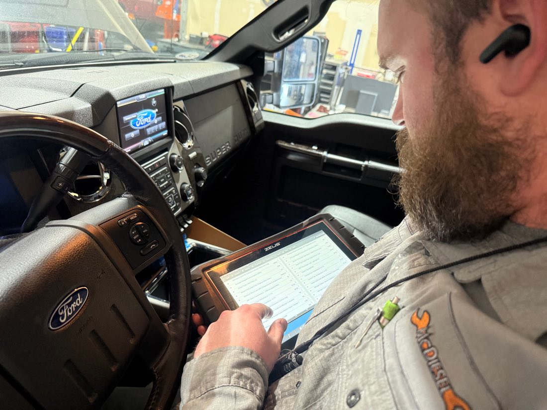 McDiesel tech working on a Powerstroke diesel truck in Sparks, NV